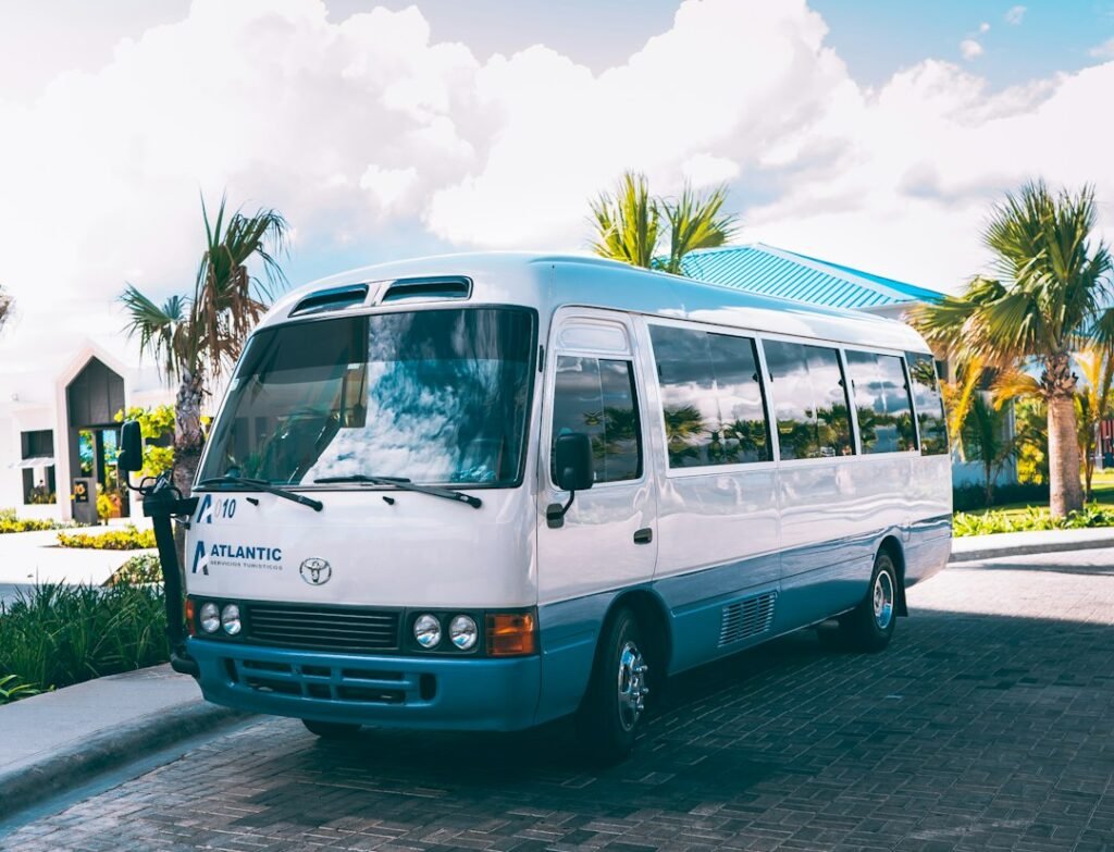 White minibus parked at the roadside